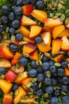 close up view of various fruits and vegetables on top of each other, including broccoli