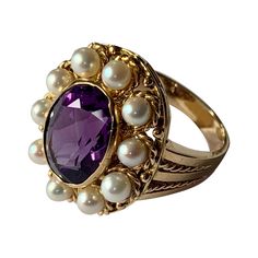 Romantic Vintage Ring in 18 K yellow Gold inspired by the Victorian era featuring an oval cut Amethyst and cultured pearls in a rope textured setting. The ring is currently size 13/53 but can be resized easily. Matching pendant/brooch available! Masterfully handcrafted piece! Authenticity and money back is guaranteed. For any enquires, please contact the seller through the message center. Victorian Luxury Amethyst Wedding Ring, Vintage Amethyst Ring Gold, Victorian Oval Pearl Ring With Gemstone, Vintage Oval Pearl Ring With Center Stone, Oval Heirloom Pearl Ring, Antique Oval Amethyst Multi-stone Ring, Classic Oval Multi-stone Amethyst Ring, Heirloom Multi-stone Oval Amethyst Ring, Heirloom Oval Multi-stone Amethyst Ring