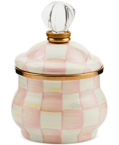 a pink and white checkered jar with a gold lid