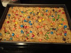 a pan filled with cereal and m & m's