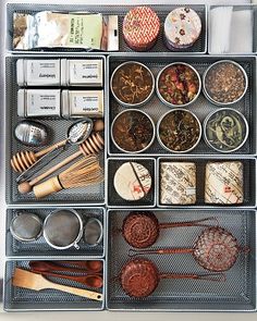 an organized drawer filled with lots of different types of food and utensils in it