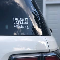 a white car parked in front of a house with the words fueled by caffeine and chaos on it