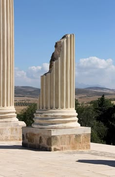 two large white pillars sitting next to each other