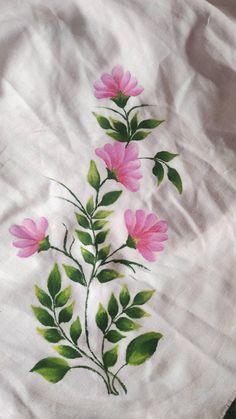 pink flowers on white fabric with green leaves