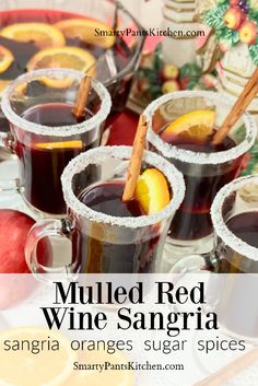 mulled red wine sangria with oranges, sugar and cinnamon on the side