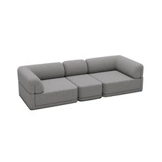 a gray couch sitting on top of a white floor