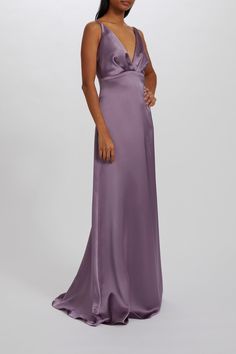 a woman in a long purple dress