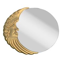 a round mirror with a golden face on it