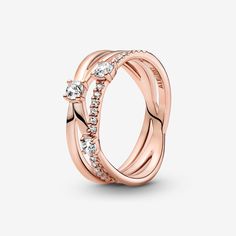 For a classic touch, go for the Sparkling Triple Band Ring. Hand-finished in 14k rose gold plating, this style features three interlinked rings. Small clear cubic zirconia decorate the top of one ring shank, while three bigger stones are set across all three for extra sparkle. As this wide-band ring has a pre-stacked look, teaming it with other shimmering Pandora Timeless rings will make a bold statement. Pandora Sparkling Triple Band Ring - Size 4.5 | Gold | 189400C01-48 Timeless Rings, Silver Wedding Gifts, Triple Band Ring, Pave Setting Ring, Pandora Rose Gold, Pandora Rose, Pear Shaped Ring, Timeless Ring, Popular Rings