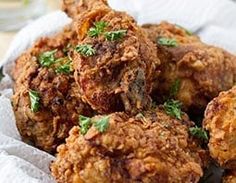 some fried food is in a basket on the table