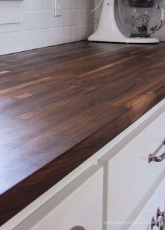 a kitchen counter top with a mixer on it