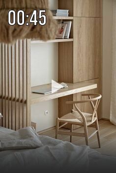 a bedroom with a bed, desk and book shelf