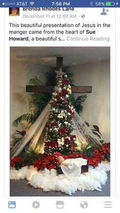 a cross decorated with red and white flowers