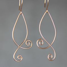 "The double serpentine spiral earrings are handmade using sterling silver wire. Free US shipping. In art, serpentine line is called\"The Line of Beauty\". S curves modulate from one gradient to another. S curves signify liveliness and activity and excite the attention of the viewer. This design is inspired by Rococo style, which is elegant, playful and uses lots of serpentine and spiral lines. Despite it popularity among the world, the Rococo is quintessentially the French Style. Customers who p Elegant Handmade Swirl Earrings, Elegant Nickel-free Copper Wire Earrings, Elegant Wire Dangle Wrap Earrings, Elegant Wire Wrap Dangle Earrings, Elegant Dangle Wrap Earrings, Elegant Silver Earrings With Copper Wire, Elegant Teardrop Copper Wire Earrings, Elegant Hand Forged Swirl Earrings, Elegant Swirl Shaped Hand Forged Earrings