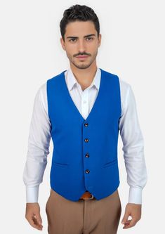 This Royal Blue Vest is designed with stretch cotton for comfort, and features a vibrant royal blue hue that is modern and bold. Looking to stand out and make your presence known? This vest is a great choice. Casual Blue Vest For Workwear, Casual Blue Vest For Work, Blue Sweater Vest For Workwear, Spring Season, Blue Sweater Vest For Spring Workwear, Blue Vest Top For Work, Fitted Blue Vest For Workwear, Blue Cotton Vest For Spring, Blue Fitted Vest For Work, Blue Sleeveless Vest For Workwear