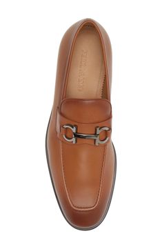 Ferragamo's iconic Gancio hardware transformed into a bit strap detail adds sophisticated style to this Italian-crafted calfskin leather loafer. Leather upper and lining/leather and synthetic sole Made in Italy Men's Designer Shoes Ferragamo Shoes Mens, Men Attire, Shoes To Buy, Gucci Loafers, Bit Loafers, Best Shoes For Men, Men's Dress Shoes, Mens Designer Shoes, Suit Shoes