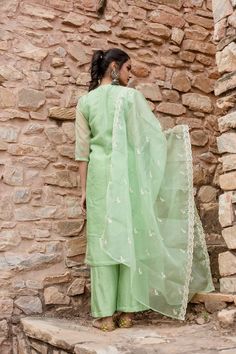 Indulge in opulent luxury with our Mint Green Embroidered Kurta Set. Made with shantoon, this set exudes sophistication and is paired with a Chanderi dupatta for added elegance. Featuring intricate embroidery, this piece celebrates traditional Indian heritage. Elevate your style with this exclusive ensemble. No. of pieces - 3 piece set. Color - Mint Green. Fabric - Shantoon. Washing Instructions - Dry Clean. Embroidered Cotton Silk Palazzo Set For Wedding, Silk Straight Kurta With Dori Work, Slub Silk Sets With Dori Work For Wedding, Festive Cotton Silk Palazzo Set With Intricate Embroidery, Designer Embroidered Pista Green Palazzo Set, Slub Silk Wedding Sets With Dori Work, Traditional Tissue Silk Straight Kurta Set, Embroidered Slub Silk Sets In Traditional Drape, Wedding Palazzo Set With Intricate Embroidery In Slub Silk