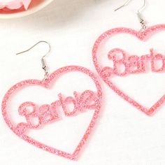 Brand New! Gorgeous Sparkling Barbie Dangling Earrings! Perfect Gift For The Barbie Lovers In Your Life! Roughly 2 Inches In Height & 2 - 1/2 Inches In Width. Prettier In Person! Color May Vary Slightly But They Are 'Barbie' Pink Show Your Barbie Love With These Gorgeous Acrylic Pink Sparkling Barbie Earrings! Perfect For Day Or Night. Perfect Present Or Gift For The Lovely Lady In Your Life! Ask Me How To Get $4.99 Shipping Every Friday! Exaggerated Acrylic Resin Handmade Earrings Jewels Jewelr Playful Personalized Pink Earrings, Trendy Heart Earrings For Birthday, Trendy Heart-shaped Earrings For Birthday, Trendy Heart-shaped Birthday Earrings, Playful Heart Shaped Party Earrings, Playful Heart-shaped Earrings For Parties, Fun Jewelry For Valentine's Day Party, Playful Heart-shaped Party Earrings, Fun Party Jewelry For Valentine's Day