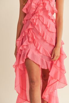 Elevate your style with our Pink Asymmetrical Maxi Dress. This stunning dress features a solid halter neckline and asymmetrical ruffle detail, adding a touch of elegance and uniqueness to your look. Crafted from a blend of 75% Rayon and 25% Polyester, with a 100% Rayon lining, it provides maximum comfort and breathability. Perfect for any occasion, this beautiful pink dress is designed to make you stand out in any crowd. Whether you're attending a special event or a casual gathering, this Pink A Ruffled Skirt Maxi Dress For Night Out, Summer One Shoulder Ruffle Dress, Flirty One Shoulder Dress With Ruffled Skirt, Flirty One-shoulder Dress With Ruffled Skirt, Feminine Ruffled Maxi Dress For Night Out, Spring Ruffled Maxi Dress For Night Out, High-low Hem Maxi Dress With Ruffles For Party, Spring Ruffled Skirt Maxi Dress For Night Out, High-low Hem Dress With Ruffles For Party