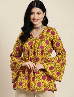 * Floral Printed Pure Cotton Kurti Printed Kurti / Embroidered Short Kurti / Indian Tunic / Summer-Spring Evening Dress / Cotton Tunic Tops Boho Tunic / Hippie Dress / Tribal Print Top * Yellow and pink a-line kurti * Floral printed * V-neck, long, bell sleeves * Machine pure cotton *Fabric:-  Pure Cotton *Wash Care:-  Machine Wash AVAILABLE IN 7 SIZES THEY ARE IN FOLLOWING MEASUREMENTS IN INCHES:- XS:- Bust-34/Waist-28/Length-32 S:- Bust-36/Waist-30/Length-32 M:- Bust-38/Waist-32/Length-32 L:- Bust-40/Waist-34/Length-32 XL:- Bust-42/Waist-36/Length-32 XXL:- Bust-44/Waist-38/Length-32 3XL:- Bust-46/Waist-40/Length-32 NOTE ►►CUSTOMISATION We do customisation ️ ►►TRACKING We give full tracking to our valuable customers, you can track your package any time with tracking code provided by our s Traditional Yellow V-neck Kurta, Yellow V-neck Traditional Kurta, Spring Yellow Tops With Printed Motifs, Festive Yellow Blouse With Printed Motifs, Yellow Printed Kurta For Spring, Festive Yellow Tops With Printed Motifs, Bohemian V-neck Top With Printed Motifs, Traditional Yellow Tops With Printed Motifs, Yellow Bohemian Kurta With Floral Print