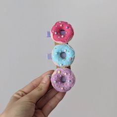 "Sweets hair accessories are the best choice for your sweety baby girl. Bright handmade felt donuts hair clips set will be a great gift for sisters or twins, or for small sweets lovers! Lovely handmade felt hair clips will fit even the smallest pigtails and add a fun detail to the child's hairstyle! You can choose 1 donut of every color, or a mixed set of 3 colorful hair accessories - check out the variation window for the best option. MATERIAL: felt, thread, beads, and love. DIMENSIONS: Donut - Felt Hair Clips Diy, Headband Diy, Donut Themed Birthday Party, Felt Hair Accessories, Felt Hair Clips, Toddler Hair Clips, Handmade Hair Accessories, Diy Headband, Making Hair Bows