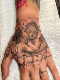 a person's hand with a tattoo on it