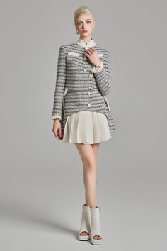 Office Tweed Mini Skirt, Elegant Mini Skirt With Pleated Hem For Fall, Fitted Tweed Pleated Skirt, Tweed Pleated Skirt For Work, Classic Tweed Skirt For Formal Occasions, Chic Tweed Skirt For The Office, Chic Tweed Skirt For Office, Elegant Tweed Mini Skirt With Lining, Fitted Tweed Elegant Skirt