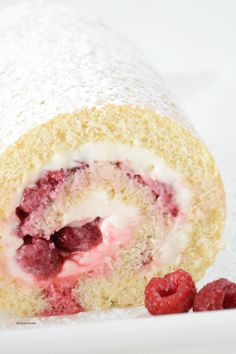 raspberry cream filled roll on a white plate