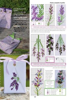 cross stitch book with instructions and pictures on the front, purple flowers in the background