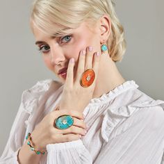 Inspired by our statement Dropping Circles earrings, we designed the Tini Mini Drops to be worn with all your everyday looks. Each semi-precious gemstone sits next to a small cubic zirconia cabochon for a subtle pop of sparkle. Add them to any outfit for colorful fun! Details Lightweight drop earrings Made of genuine blue mohave turquoise and cubic zirconia stone Skillfully handcrafted in 14k gold over recycled brass Our gold plating is twice as thick as the industry standard and finished with a Elegant Turquoise Enamel Earrings, Modern Enamel Jewelry With Gemstone, Blue Cabochon Fusion Jewelry, Modern Oval Turquoise Jewelry, Modern Turquoise Oval Jewelry, Turquoise Cabochon Drop Earrings, Turquoise Jewelry With Matching Earrings, Fine Jewelry Turquoise Gemstone, Turquoise Gemstone Fine Jewelry