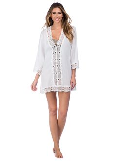 This lightweight cotton swimwear tunic by La Blanca features a crochet center panel in front to peep your swimsuit just beneath. Crochet trim along the neckline, cuffs and hem of this cover-up add a hint effortless elegance. [split] Details Swimwear cover up V neck tunic Crochet trim Long sleeves Fabric 100% Cotton (Crinkle voile) V-neck Beach Dress With Lace Trim, Chic Lace Trim Beach Cover-up, Summer Beach Tops With Split Neck, Beachwear V-neck Beach Dress With Lace Trim, Beachwear Swimwear With Crochet Trim, Crochet Trim Swimwear For Beach, Beachwear Tops With Crochet Trim For Beach Cover-up, Spring Vacation Swimwear With Crochet Trim, Beachwear V-neck Cover-up For Daywear