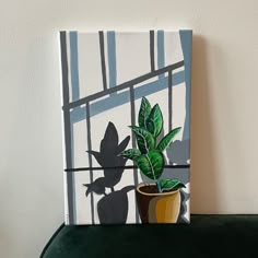 a potted plant sitting on top of a green shelf next to a white wall