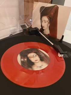 a record player with an image of a woman on it