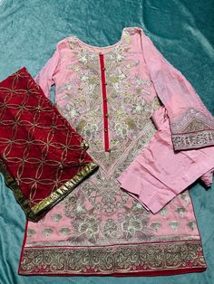 size:Medium  Heavy embroidered Stitched 3piece dress. Shirt: front heavy embroidered and embroidered on back & design on sleeves and shirt bottom. Dupatta: heavy embroidery on chiffon  bottom:straight plain pant No return or exchange please. Note:Please contact me if you have any problem with your order. Pink Embroidered Chinon Salwar Kameez, Eid Chanderi Dress With Floral Embroidery, Formal Chanderi Traditional Wear With Floral Embroidery, Pink Embroidered Dola Silk Kurta, Embroidered Anarkali Salwar Kameez In Shantoon, Pink Dola Silk Kurta With Embroidery, Semi-stitched Embroidered Shantoon Sharara, Semi-stitched Embroidered Sharara In Shantoon, Pink Embroidered Lawn Suit For Diwali