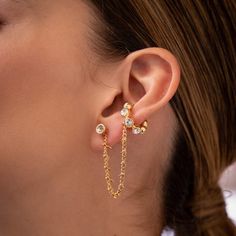 Step up your ear game this season with these essential ear cuffs, designed for your everyday stack. 24K Gold-plated bronze One size This set includes 2 earrings + an earcuff chain No piercing needed for earcuff chain How to wear: Slide cuff behind the ear down to the middle and hook it around the ear. 2 Earrings, Ear Cuffs, Fantasy Jewelry, The Ear, Ring Bracelet, Ring Necklace, Sales Gifts, Jewelry Stores, Anklets