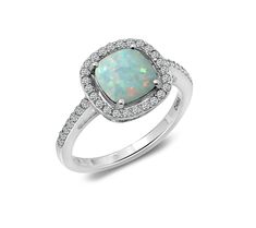 Maybe you're an October baby. Or maybe you're simply enamored with the shimmering beauty of opals. Either way, we think you're going to love this opal ring that's accented with a sprinkling of dazzling cubic zirconia Diamonique simulated diamonds. Opal Promise Ring With Center Stone, Fine Jewelry Opal Promise Ring, Adjustable Opal Ring With Accent Stones For Anniversary, October Baby, Opal Ring, Halo Ring, Halo Rings, Ring Sterling Silver, Opal Rings