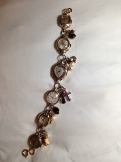 This is my vintage "time piece" bracelet. Made from vintage women's watches, necklace pendants, and charms. 90s Watch Aesthetic, Watch Jewelry Ideas, Vintage Bracelet Watch, Clock Bracelet, Vintage Jewelry Diy, Vintage Jewelry Ideas, Vintage Jewelry Repurposed, Vintage Jewelry Crafts