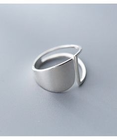 Give your everyday look a healthy dose of shine with this silver ring! Crafted with high-quality sterling silver 925, this geometrically elegant piece will upgrade any outfit with effortless style. It's the perfect go-to accessory for the modern girl on-the-go! Shine bright like a diamond with this beautiful silver ring! Luxury Minimalist Sterling Silver Rings, Trendy Sterling Silver Jewelry With Open Band, Modern Sterling Silver Midi Rings, Trendy Sterling Silver Open Band Jewelry, Trendy Silver Open Band Ring, Modern Midi Rings With Polished Finish, Minimalist Stamped 925 Midi Rings, Modern White Gold Midi Rings, Modern Sterling Silver Open Band Rings