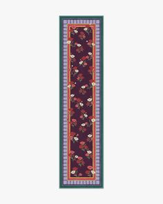 a long rug with flowers and stripes on it