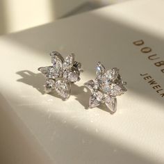 Luxury Bridal Studs for Every Day ✨💎 It gives you beautiful, attractive and outstanding jewelry experience ✨ * Everlasting Confidence * Wonderful Quality * Stay Shiny * Exquisite Fit * Over 17,000 cumulative user reviews, rating 4.8+/5 Timeless Elegance: Moissanite Cluster Earrings Experience the ultimate fusion of luxury and practicality with DOUBLE ACCENT's Moissanite Cluster Sunlit Petals Stud Earrings. Crafted for the modern bride who appreciates the beauty of opulence, these earrings are n Luxury Cluster Platinum Jewelry, Luxury Fusion Diamond Earrings, Classic Silver Flower Earrings For Wedding, Wedding Earrings With Sparkling Flower Stones, Wedding Cubic Zirconia Crystal Earrings In Flower Shape, White Gold Cubic Zirconia Flower Earrings For Wedding, Wedding Crystal Earrings With Cubic Zirconia In Flower Shape, Flower-shaped Sparkling Stones Earrings For Wedding, Diamond White Flower Shaped Earrings For Wedding