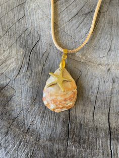 Handpicked shell from Nokomis Beach, Florida.  Gold starfish charm and necklace. I walk my local beach almost every morning in SW Florida.  I collect all kinds of shells, rocks, fossils and teeth.  Since I can't stop collecting, I decided to start making jewelry and crafts out of my beloved beach treasures.  Everything in my shop was happily hand-picked and hand-crafted by me :)  5% of all my Etsy sales go to Mote Marine in Sarasota Florida, specifically to help fund Turtle Patrol, they mark and Florida Jewelry, Necklace Shell, Beach Items, Cardboard Jewelry Boxes, Starfish Pendant, Jewelry Real, Starfish Necklace, Sarasota Florida, Resin Necklace