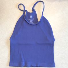 Nwot, No Outside Logo, Inside Logo Fading Due To Misprint. Fit: Slim. Scoop Neck Silhouette Features: Cropped Design, Seamless Rib Fabrication, Racerback Design, Entry-Level Compression Why We <3 It: So Effortless With Or Without A Bra, This Tank Will Be Your Go-To From The Studio To The Street. Blue Seamless Tops For Vacation, Seamless Blue Tops For Vacation, Seamless Blue Tank Top For The Beach, Casual Spring Halter Top For Workout, Casual Spring Workout Halter Top, Blue Seamless Summer Tops, Blue Seamless Crop Top For Spring, Casual Blue Halter Top For Vacation, Blue Stretch Summer Tops