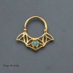 "24k Gold plated or Sterling Silver Septum Ring with Opal gemstone, Daith Earring, also fits Helix, Daith, Tragus, Cartilage Earring Jewelry, Tribal Unique Earring, available in 18g oooo Piercing rings are super on-trend jewelry. Find a ring that works best for your personality. You could go subtle and rock a simple one, or you can go bold and wear one that's colorful! This septum ring, taken from my FLOWER OF LIFE Collection, is made of 24k Gold Plated over Sterling Silver (2 microns) and set w Gold Crescent Cartilage Earrings Nickel Free, Celestial Gold Jewelry For Festivals, Mystical Round Brass Jewelry, Celestial Style Pierced Jewelry For Festivals, Handmade Brass Body Jewelry As A Gift, Handmade Celestial Gold Jewelry, Celestial Jewelry For Festivals, Gift Metal Septum Ring Internally Threaded, Unique Gold Metal Cartilage Earrings