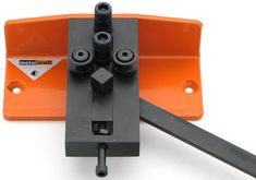 an orange and black object with tools attached to it