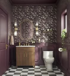 a bathroom with a checkered floor, purple walls and gold fixtures on the wall