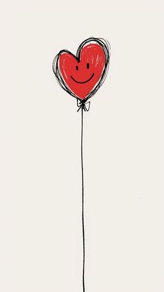 a drawing of a red heart balloon with a smiley face on it's side