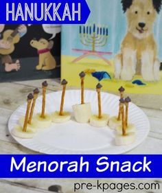 there is a paper plate with food on it and the words hanukkah written in hebrew