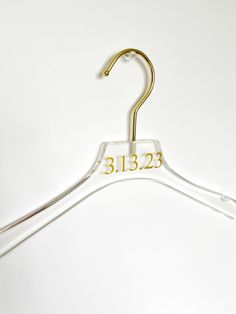 Show off your beautiful wedding gowns and bridesmaids dresses with these elegant clear acrylic hangers.  F E A T U R E S:  * One personalized hanger * Measures 17.5" Inches * Hanger is clear acrylic with gold hardware * Date can be customized * Color of vinyl for text can be customized    O T H E R *  No returns/exchanges are accepted for customized items but please reach out to us with any questions about your order! S H I P M E N T * All hangers ship out 2-3 days after purchase from New Jersey!  * All orders come with tracking number. * Please leave a note of any deadlines ! * USPS current first class shipment turn out is 3-5 days           - want to rush ? purchase our rush fee from the link below https://www.etsy.com/listing/1002073559/rush-fee?ref=shop_home_active_54 M O R E  * IG: @l Gold Theme Wedding, Acrylic Hangers, Bridesmaid Hanger, Gold Hangers, Bridesmaid Hangers, Bride Hanger, Gold Wedding Theme, Wedding Dress Hanger, Dress Hanger