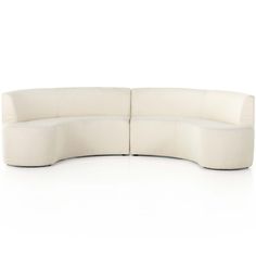 the curved sectional sofa is white and has two seats on each side, with one end facing