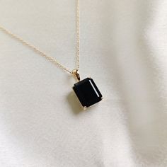 This stunning pendant is set in 14k Solid Yellow Gold with Natural Black Onyx with utmost precision. It is a unique gemstone pendant for nearly every occasion and is completely hassle-free jewelry. ITEM DETAILS: * GEM: Black Onyx * GEM Size: 10x12mm * GEM Shape: Octagon (Emerald Cut) * Gem Weight: 6.00 carats * Gold Purity: 14KT  * Gold Weight: 1.07 gram * Total Weight of the Pendant: 2.27 gram The Gold purity is guaranteed and it comes with an authentic 14KT gold hallmark. Since my items are ha Black Gem Necklace, Timeless Black Spinel Jewelry Gift, Formal Black Spinel Jewelry, Classic Black Spinel Jewelry, Black Enamel Necklace For Anniversary, Timeless Black Jewelry For Anniversary, Yellow Gold Black Spinel Jewelry As A Gift, Timeless Black Gemstone Jewelry, Black Pendant Jewelry For Anniversary